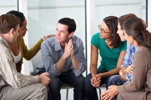 a group participates in addiction counseling