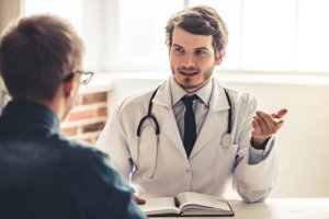 individual discussing psychiatric disorders with his doctor